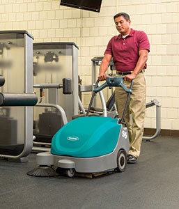S5 walk-behind sweeper cleaning a weight room S5 walk-behind sweeper cleaning a weight room